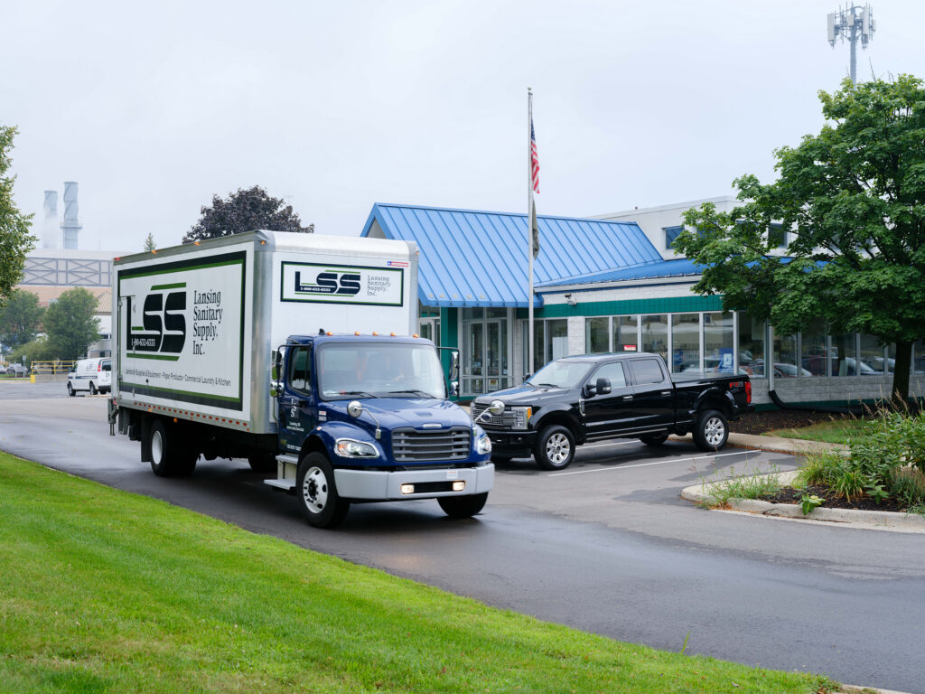 An LSS box truck and pickup outside the Lansing headquarters
