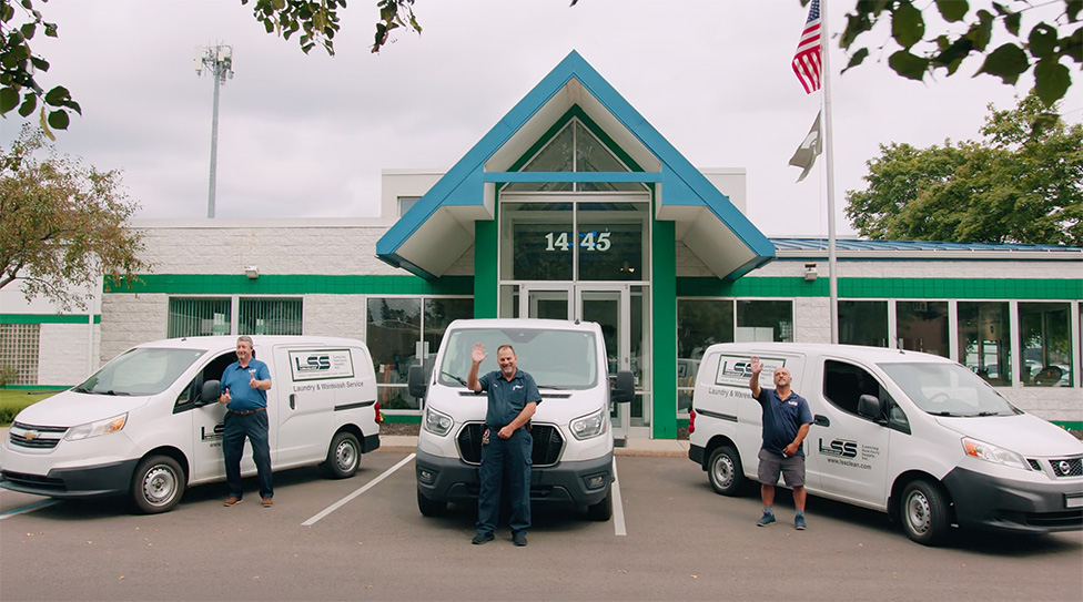 LSS staff outside the Lansing headquarters with the delivery vans